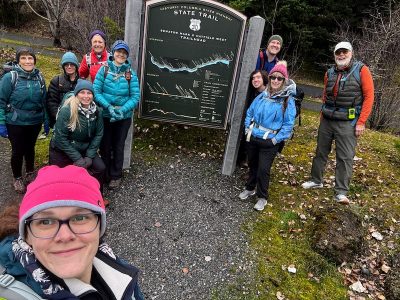 Hiking group at Doug O Hatfield West Trailhead sign.