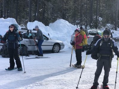 Skiers and snowshoers getting ready for the icy trek to the Gold Hill Cabin